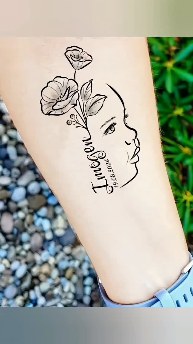 Tattoo on a forearm showing a child's profile with flowers and birth date.
