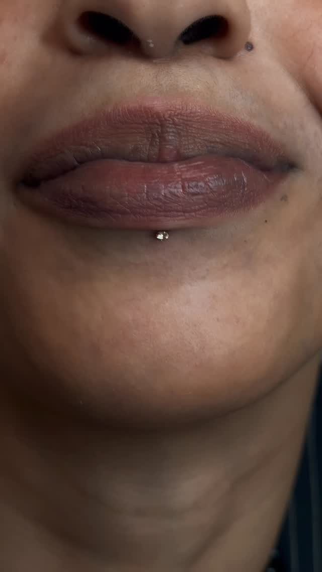 Center Lip Piercing Ideas: 7 Styles to Consider 5 Lower face and lips featuring a center labret piercing with a silver stud.
