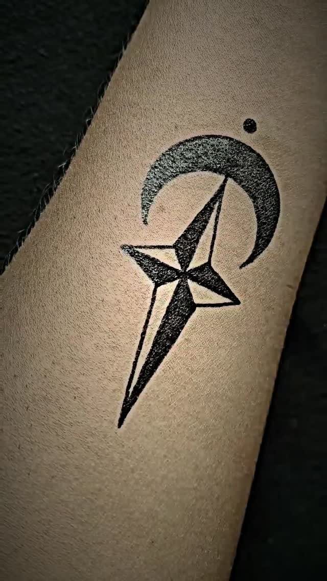 15 Hand Pen Tattoo Ideas for Spider Webs, Flowers and More 6 Crescent moon and stylized star tattoo in black ink on skin.