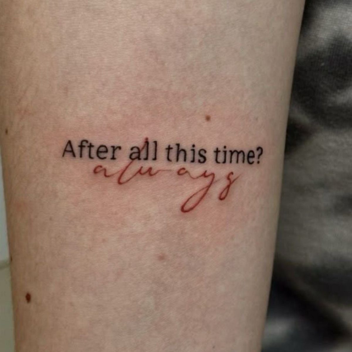 Tattoo on skin with black text 'After all this time?' and red 'always' script.