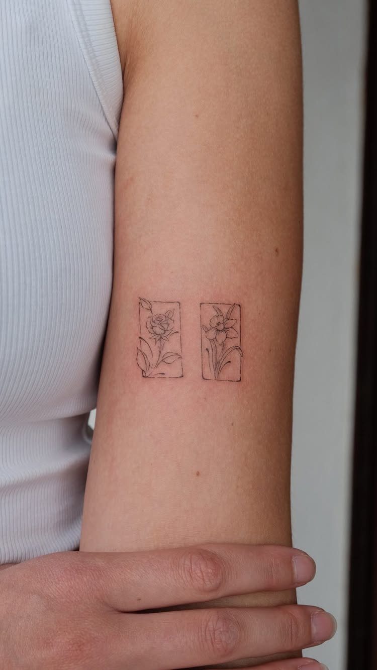Minimalist Fine Line Tattoo Ideas: 9 Styles to Consider 9 Two small rectangular fine line flower tattoos on a person's upper arm