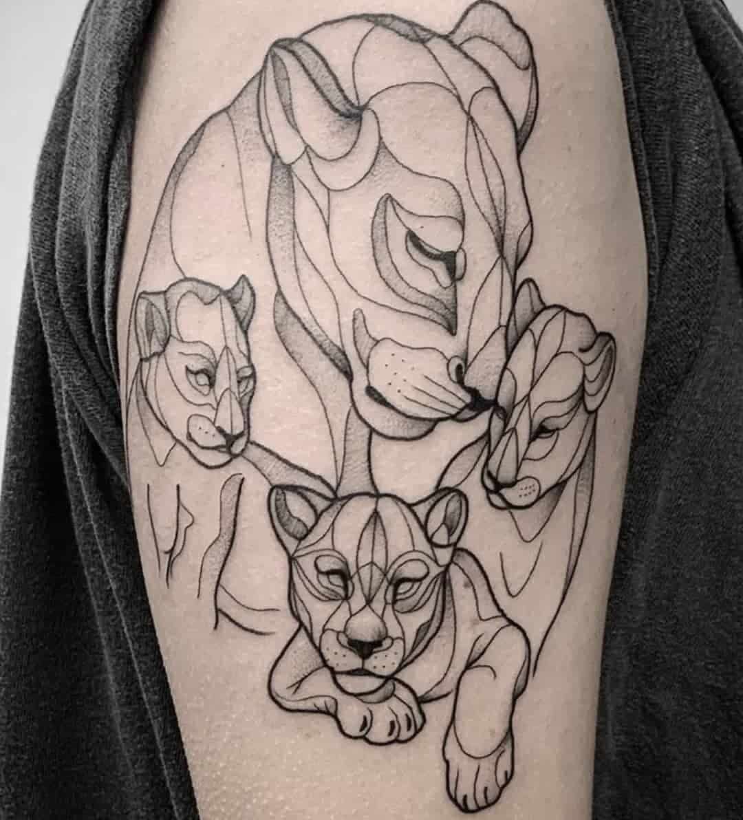 Lioness and three cubs tattoo in geometric line art on a person's arm.