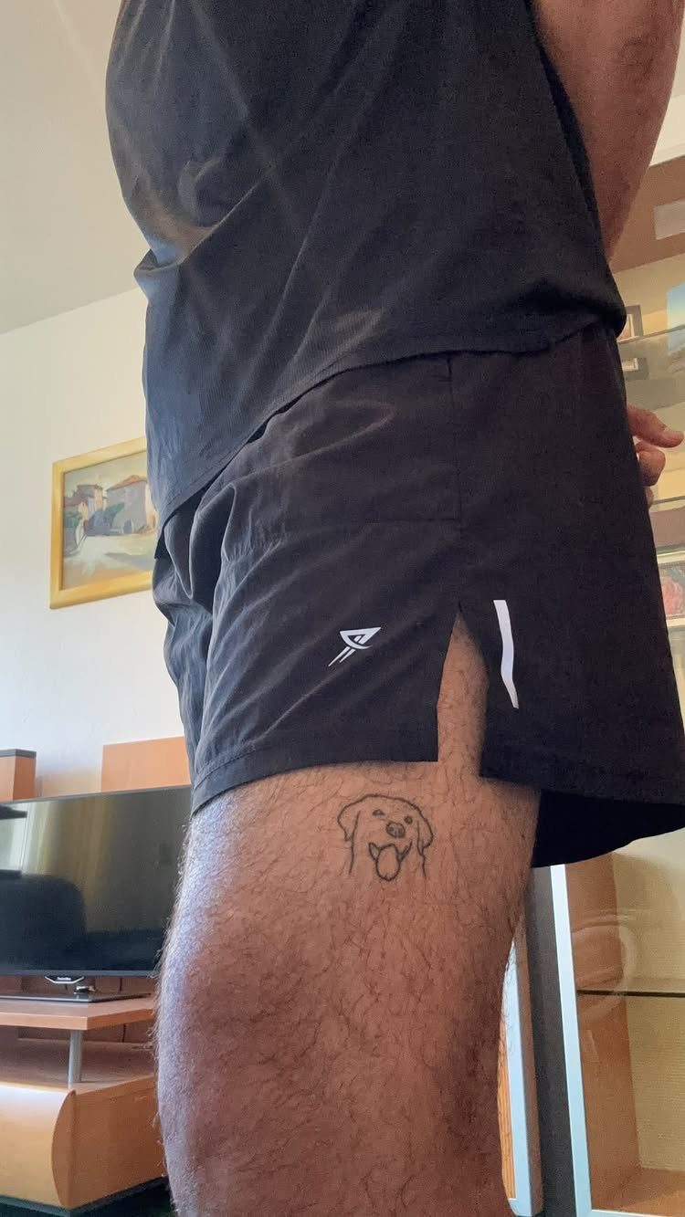 26 Self Tattoo Ideas for Simple, Meaningful Ink 19 Small black ink line drawing of a dog's face tattooed on a person's thigh.