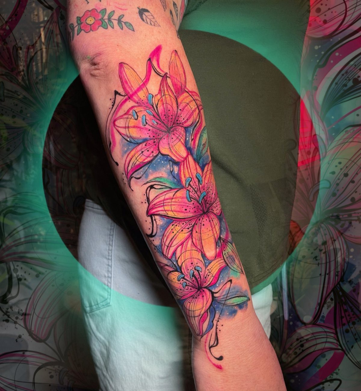 26 Self Tattoo Ideas for Simple, Meaningful Ink 9 Colorful lily flower tattoo on a person's forearm with pink and orange petals.