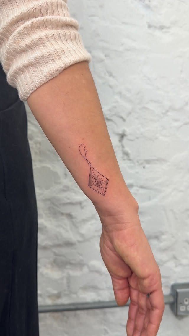 26 Self Tattoo Ideas for Simple, Meaningful Ink 22 Small minimalist kite tattoo with a string on a person's inner forearm.