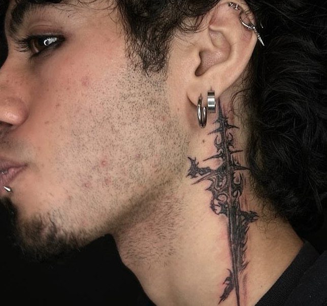 21 Side Neck Tattoo Ideas for Bold, Meaningful Designs 18 Person with a black ink sword tattoo on the side of their neck