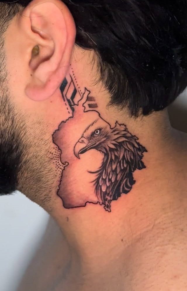 21 Side Neck Tattoo Ideas for Bold, Meaningful Designs 6 Eagle head tattoo merged with a map outline on a man's side neck.