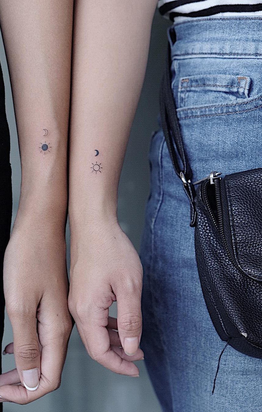 26 Small Pretty Tattoos for Butterflies, Stars, and More 9 Small sun and moon tattoos on the inner wrists of two people.