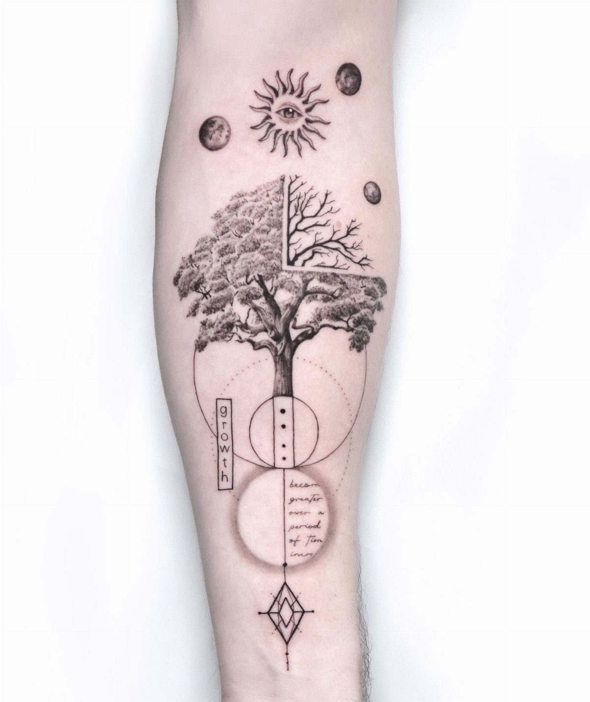 Tree of life tattoo with celestial symbols and geometric lines on an arm