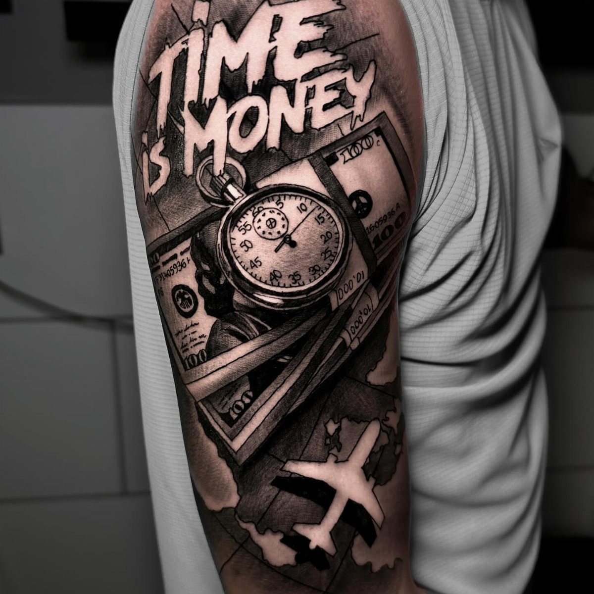 Tattoo on an arm with 'TIME is MONEY' text, a pocket watch, and money.