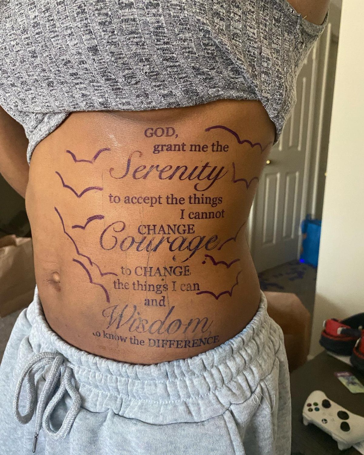 Tattoos Around Belly Button: 8 Best Ideas to Consider 7 Tattoo of the Serenity Prayer with birds on a person's stomach and waist
