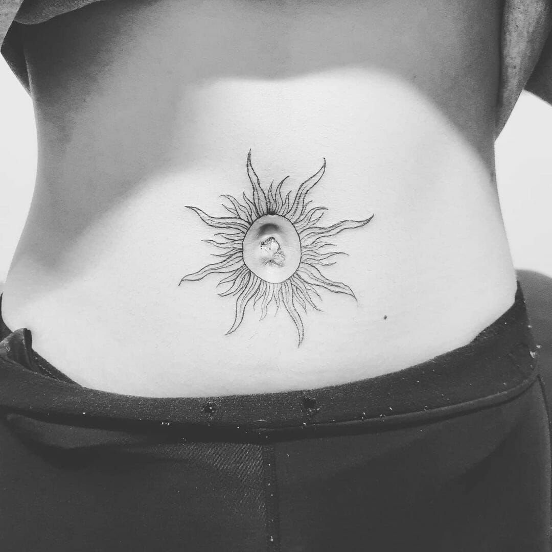 Tattoos Around Belly Button: 8 Best Ideas to Consider 1 Sun tattoo with radiating rays centered around a person's belly button.