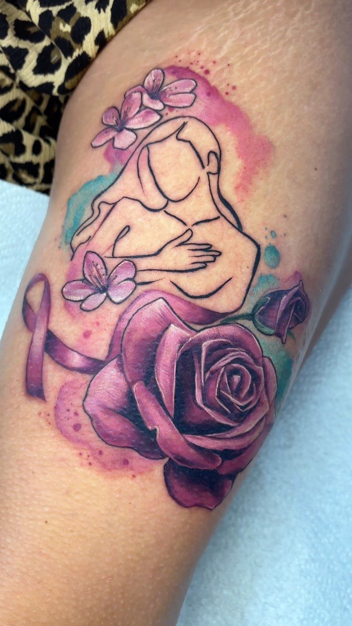 Breast cancer recovery tattoo with a pink ribbon, purple rose, and woman's silhouette.